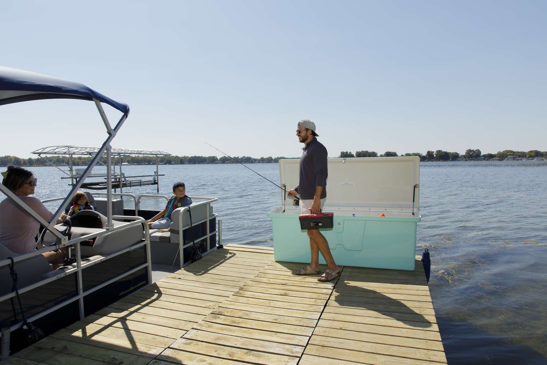 Boat on dock with dock steps, dock edging and dock box